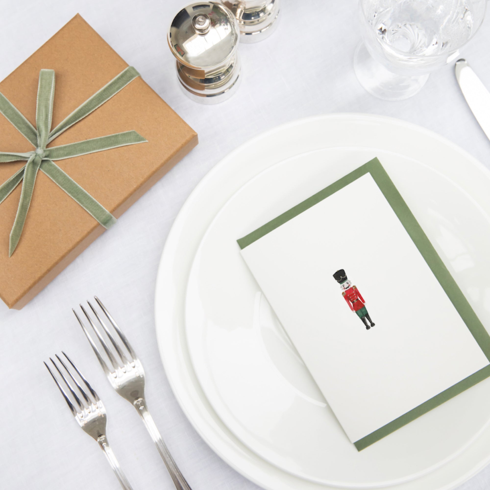 Luxury Christmas Card by Memo Press with a watercolour illustration of a Nutcracker solider and comes with a green envelope made in Britain