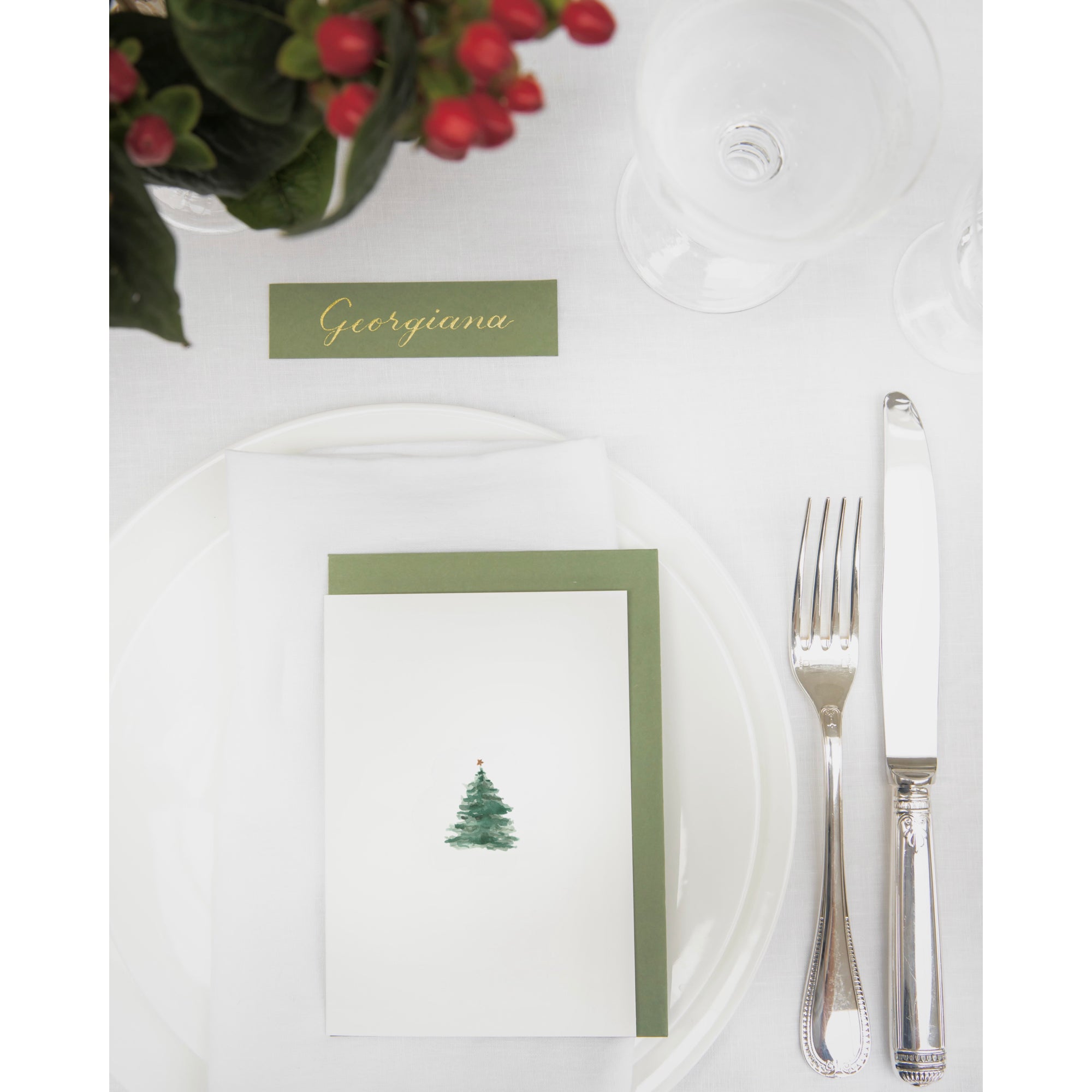 Luxury Christmas Card by Memo Press with a watercolour illustration of a traditional Christmas Tree with a single star on top and comes with a olive green envelope made in Britain