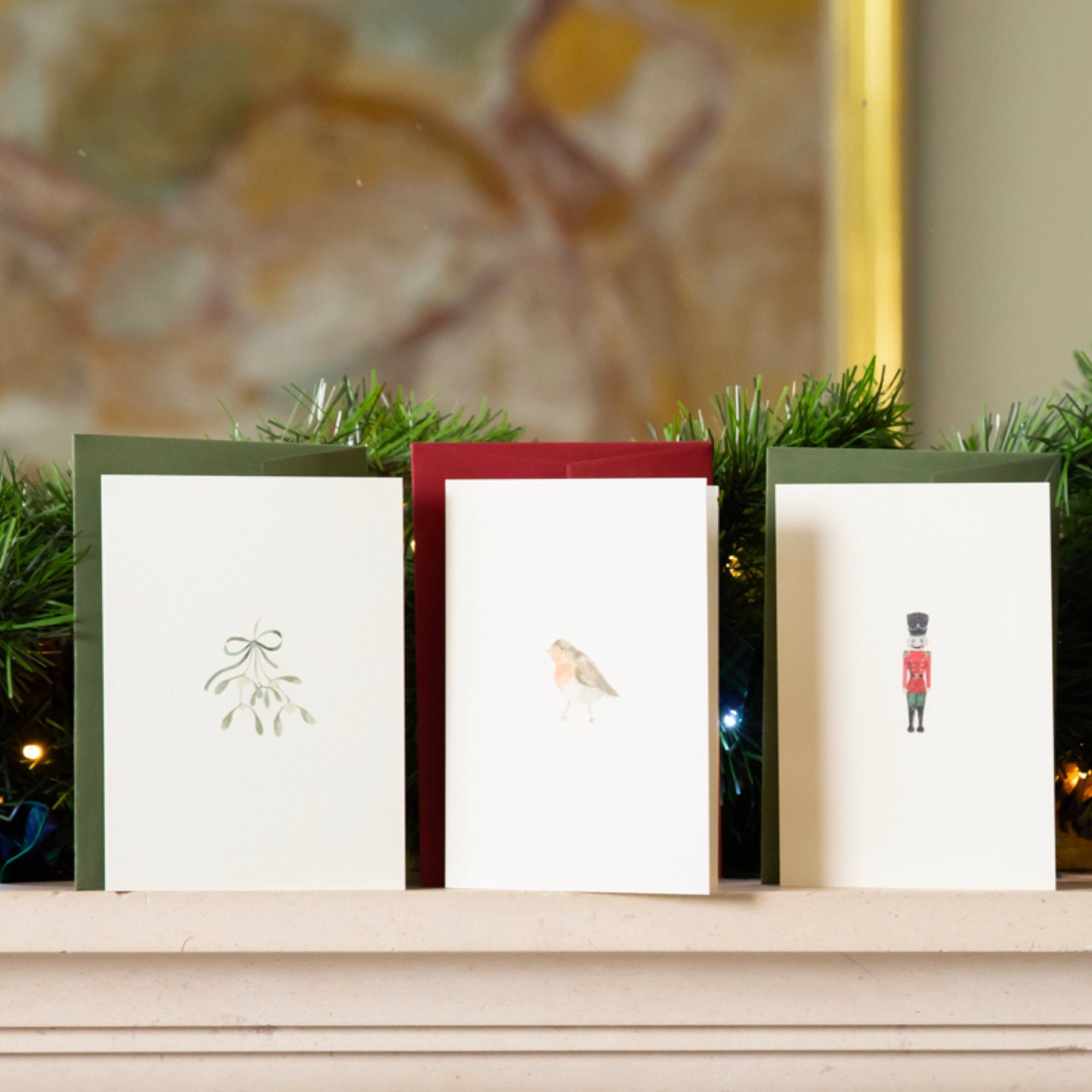 Luxury Christmas Card by Memo Press with a watercolour illustration of a Robin Redbreast and comes with a scarlet envelope made in Britain
