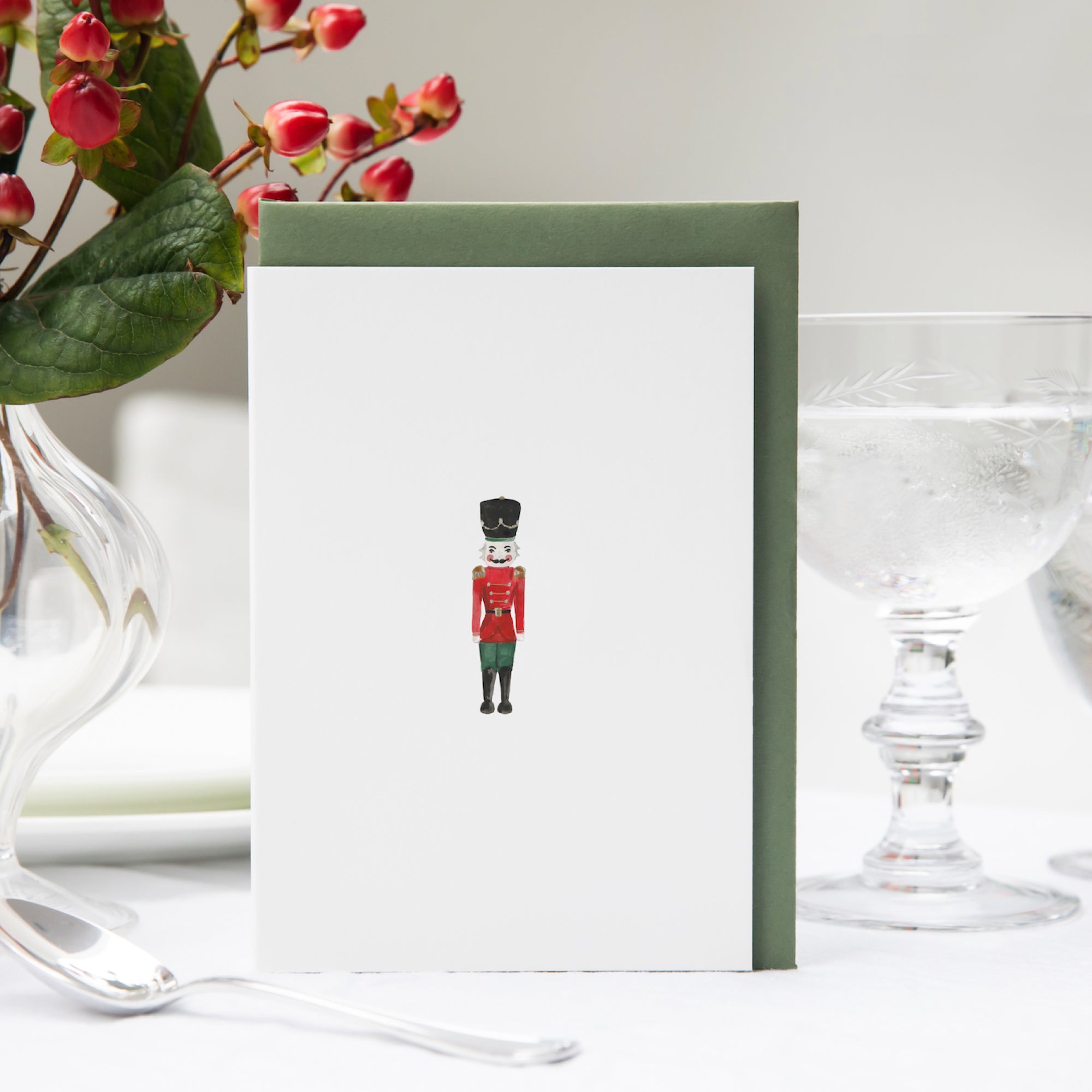 Luxury Christmas Card by Memo Press with a watercolour illustration of a Nutcracker solider and comes with a green envelope made in Britain