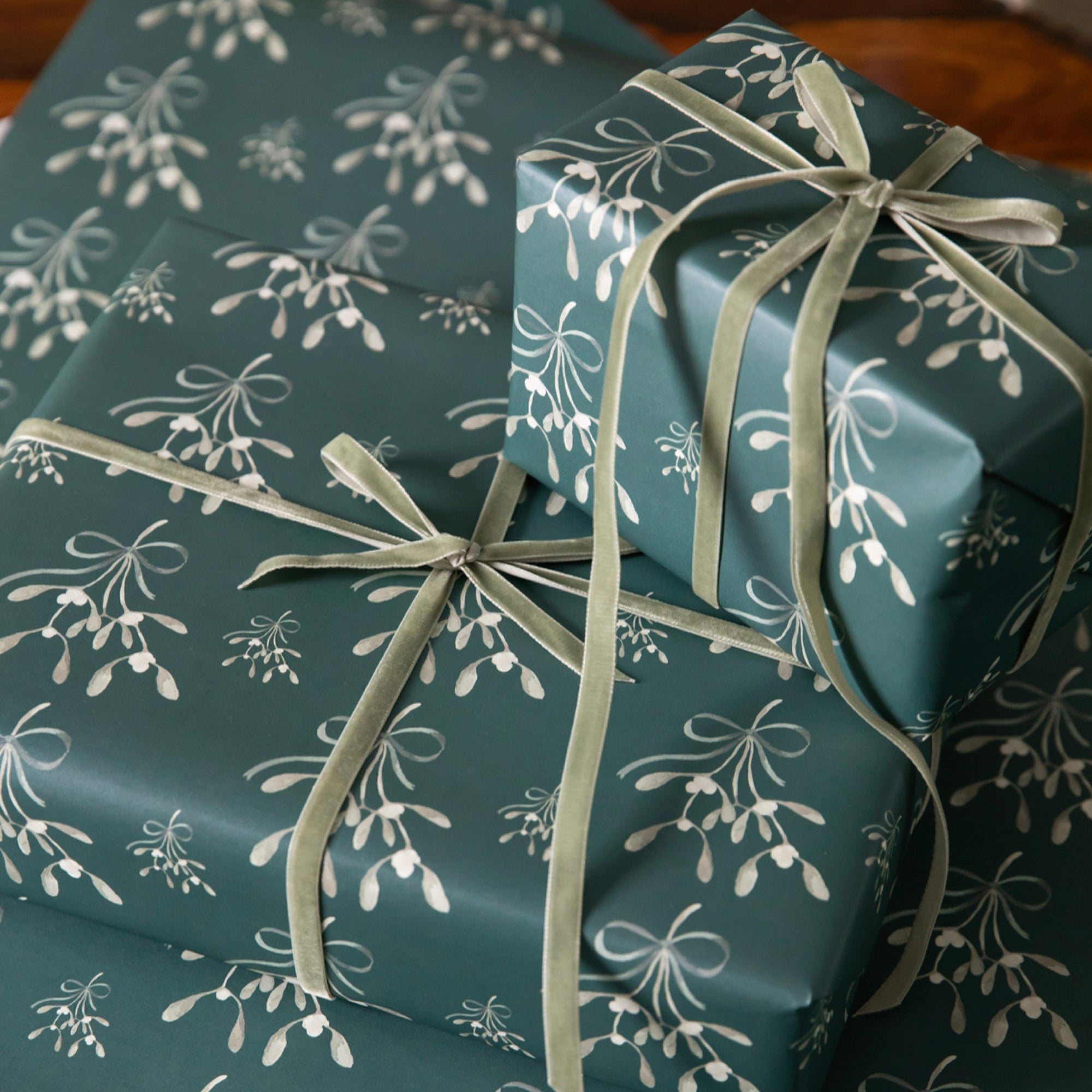 Luxury Christmas Wrapping Paper by Memo Press with a watercolour illustration of a Mistletoe made in Britain