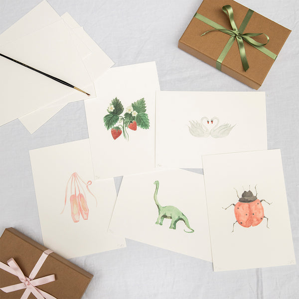 Set of limited edition prints by Memo Press of a strawberry plant, diplodocus, ballet shoes, pair of swans and ladbird