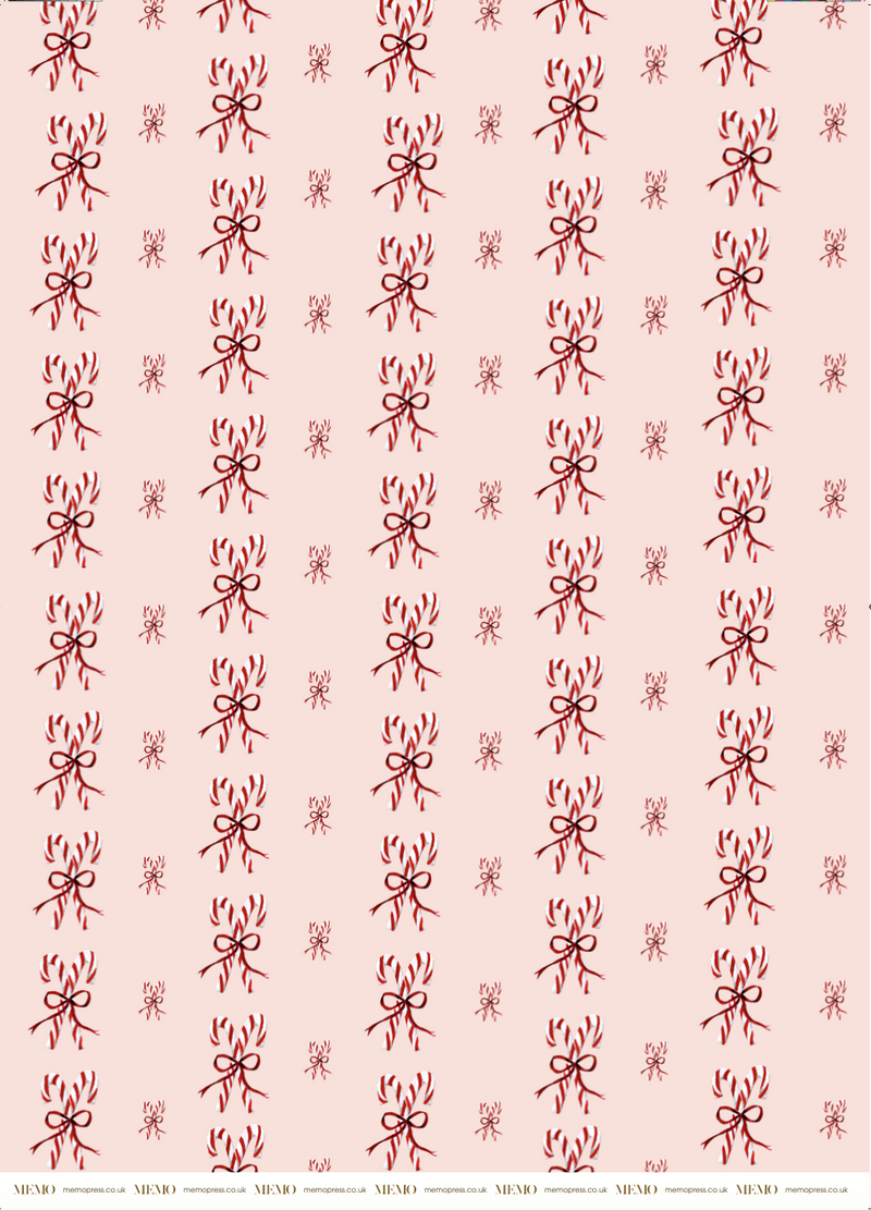 Luxury Christmas Wrapping Paper with watercolour illustrations of Candy Canes tied in a bow on shell pink paper by Memo Press