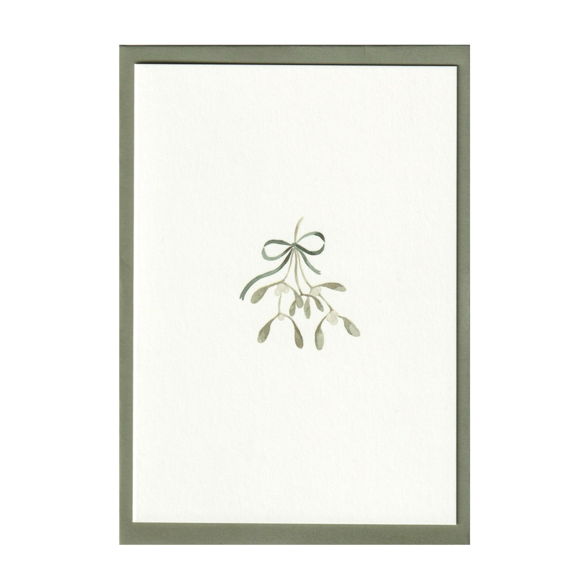 Luxury Christmas Card by Memo Press with a watercolour illustration of mistletoe tied with a ribbon tied with a bow and comes with a green envelope made in Britain