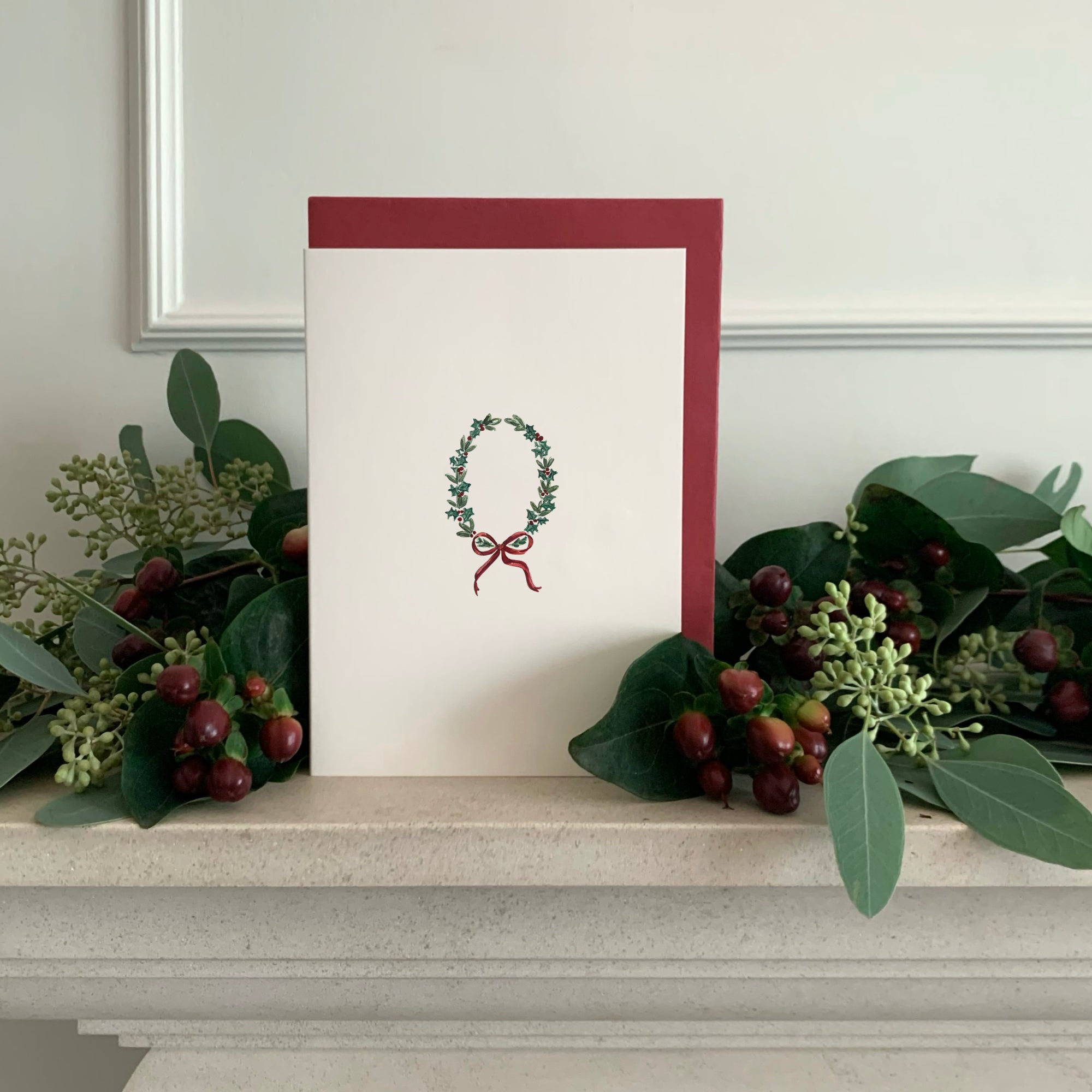Luxury Christmas Card by Memo Press with a watercolour illustration of a Wreath and comes with a Scarlet Red envelope made in Britain