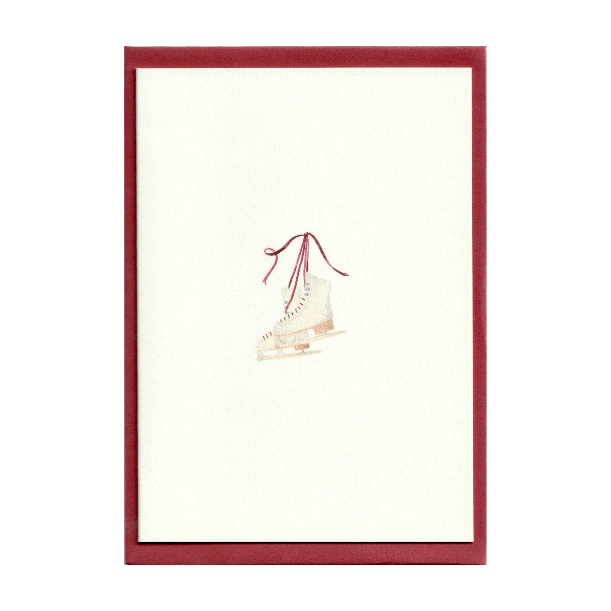 Luxury Christmas Card by Memo Press with a watercolour illustration of a pair of ice skates comes with a scarlet red envelope made in Britain
