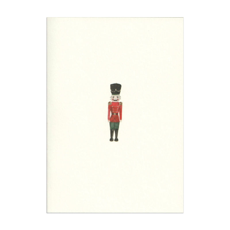 Luxury Christmas Card by Memo Press with a watercolour illustration of a Nutcracker solider and comes with a green envelope made in Britain